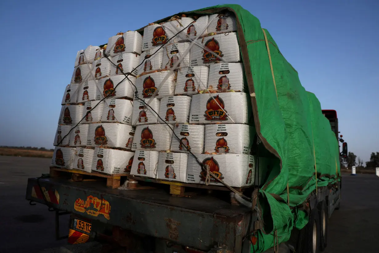 FILE PHOTO: A food aid truck sits abandoned near the entrance to the Kerem Shalom border crossing, as military operations continue in the southern Gaza city of Rafah, at an area outside Kerem Shalom