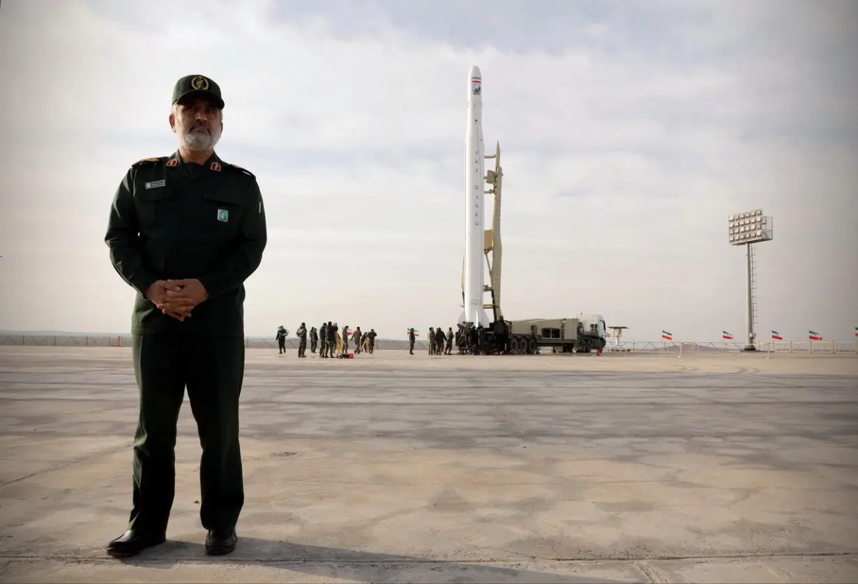 Amirali Hajizadeh, head of the aerospace division of the Revolutionary Guards, stands before a launch of the first military satellite named Noor into orbit by the Iran's Revolutionary Guards Corpse, in Semnan