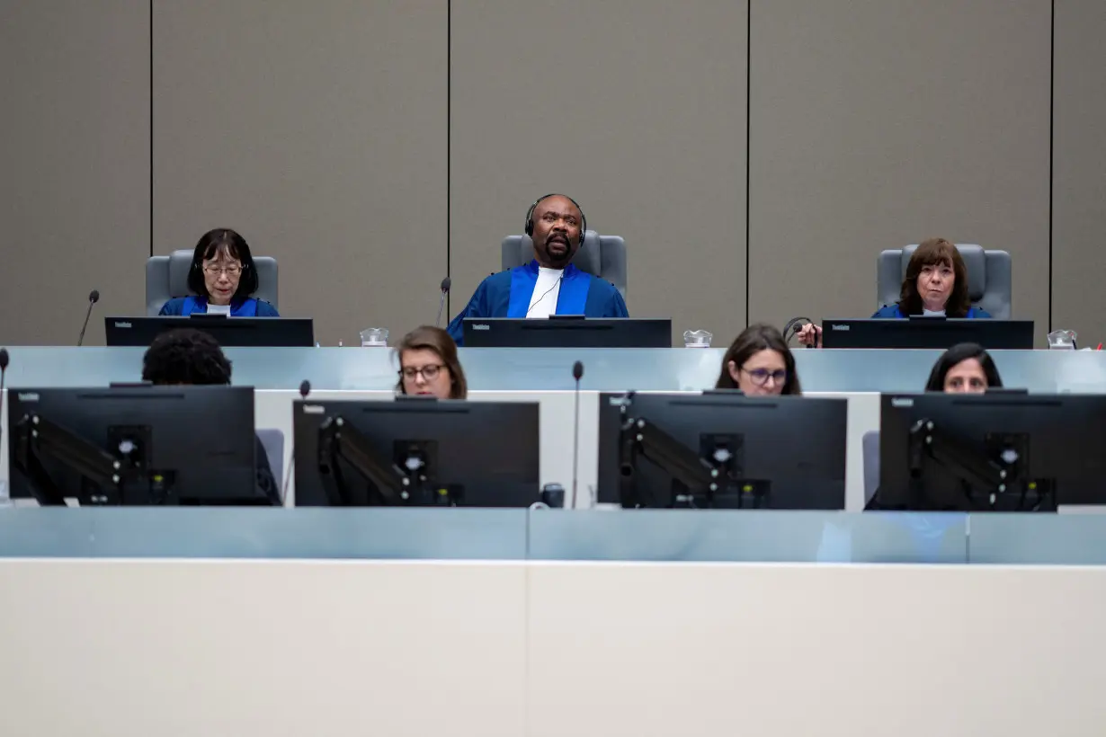 Presiding judge Antoine Kesia-Mbe Mindua, Judge Tomoko Akane, and Judge Kimberly Prost prepare to deliver the verdict in the case of Al Hassan Ag Abdoul Aziz Ag Mohamed Ag Mahmoud at the International Criminal Court in The Hague