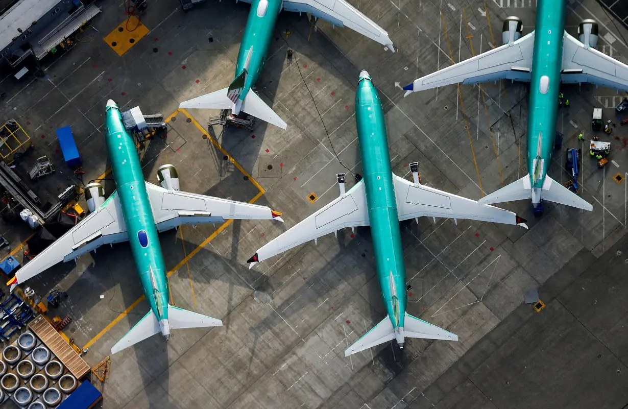 An aerial photo shows Boeing 737 MAX airplanes parked on the tarmac at the Boeing Factory in Renton, Washington, in March 2019. The US Justice Department is nearing an agreement with Boeing.