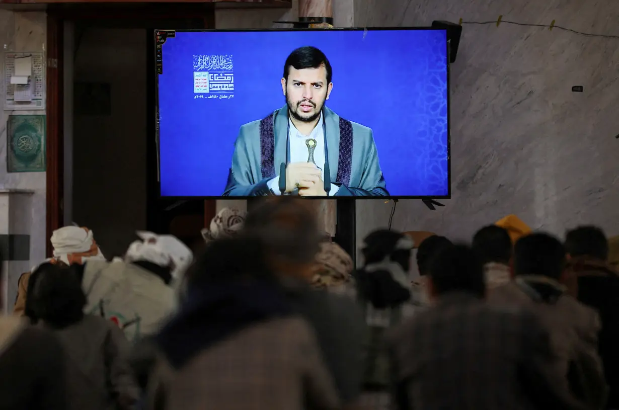 FILE PHOTO: Newly recruited Houthi fighters watch a recorded lecture on Israel and the Jews by the Houthi movement's top leader, Abdul-Malik al-Houthi, during a ceremony at the end of their training in Sanaa