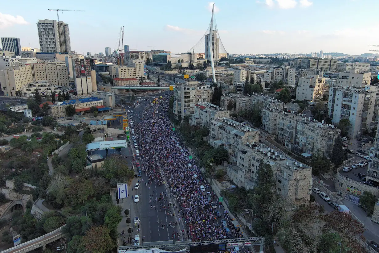 Family members, friends and supporters of Israelis and other nationalities who were taken hostage on October 7 by Palestinian Islamist group Hamas, complete their march into Jerusalem