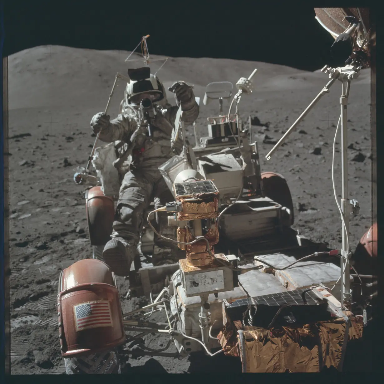 FILE PHOTO: Scientist-astronaut Harrison H. Schmitt is photographed seated in the Lunar Roving Vehicle (LRV) during the third Apollo 17 extravehicular activity during the Apollo 17 mission in this NASA handout photo