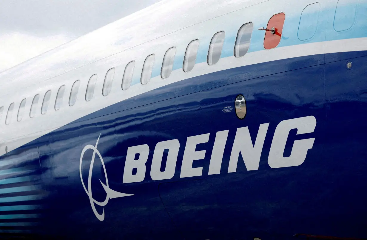 FILE PHOTO: The Boeing logo is seen on the side of a Boeing 737 MAX at the Farnborough International Airshow