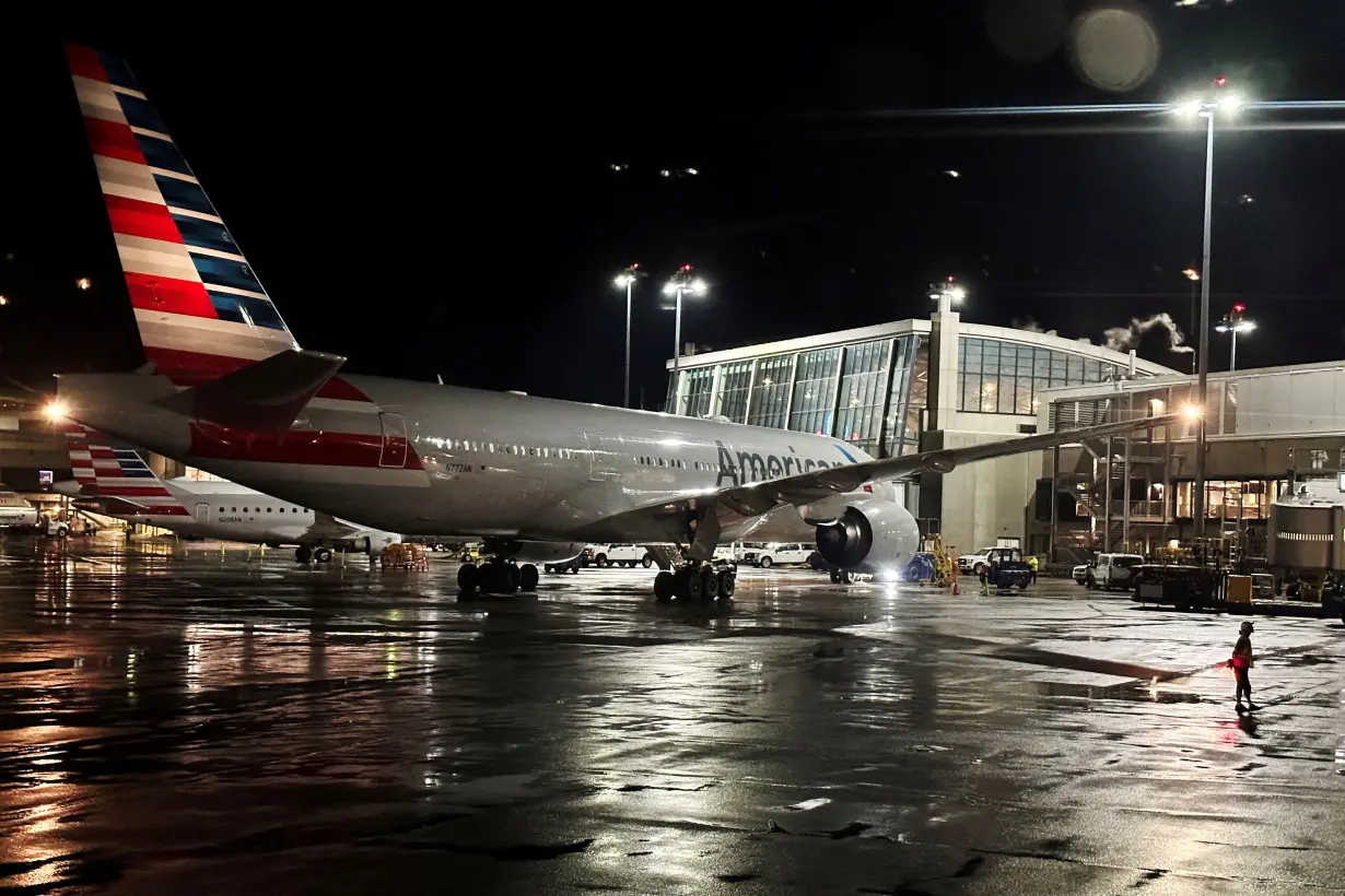 FILE PHOTO: An American Airlines plane sits at a gate at Logan Airport ahead of the July 4th holiday in Boston