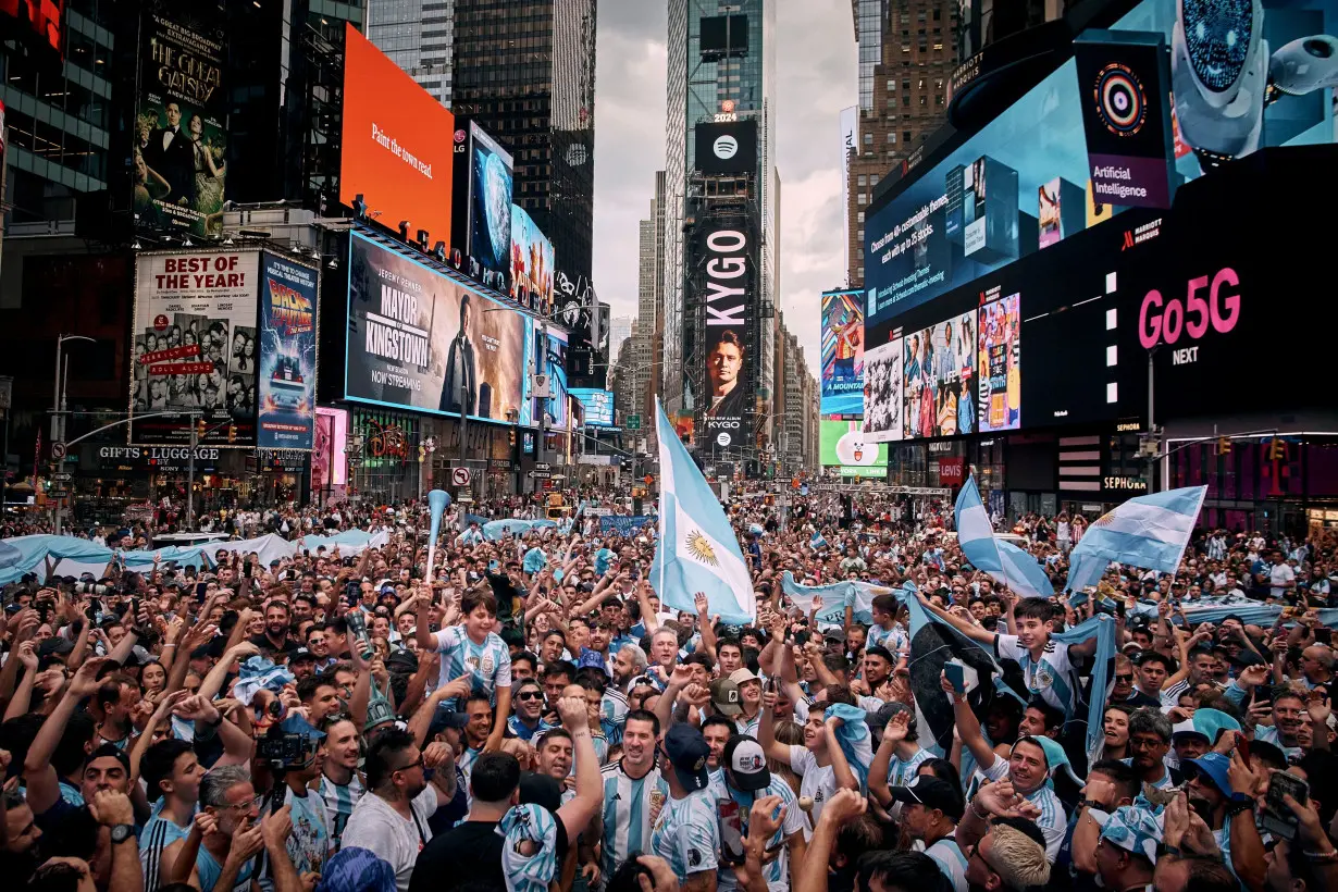Argentinian fans sing and cheer as they congregate in New York City's Times Square on June 24 to support their national soccer team.