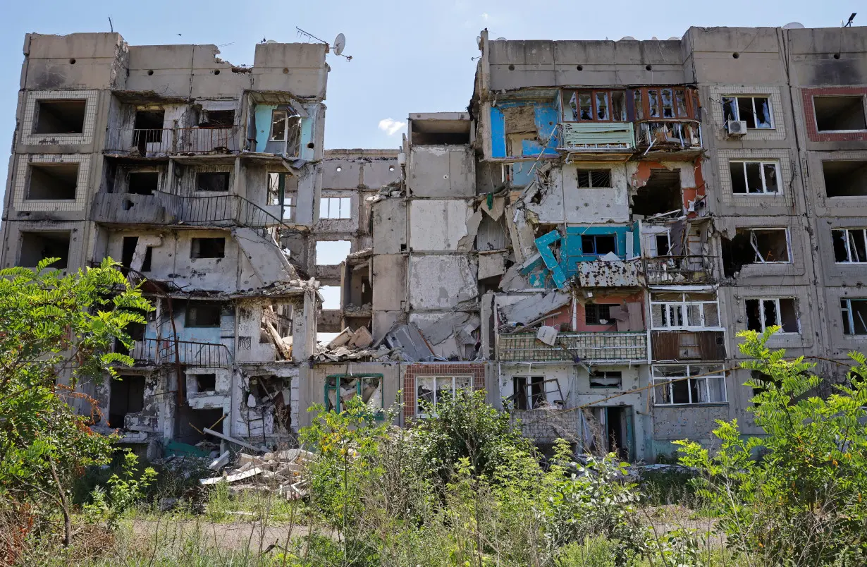 A view shows a destroyed apartment building in Toshkivka