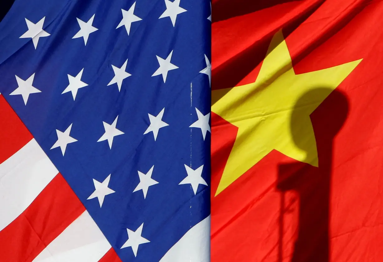 FILE PHOTO: National flags of the U.S. and China in Beijing