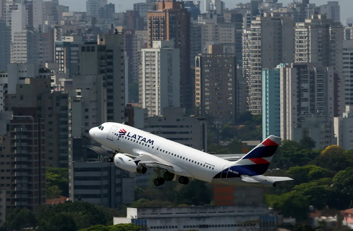 FILE PHOTO: A LATAM Airlines Brasil Airbus A319 plane takes off from Congonhas airport in Sao Paulo