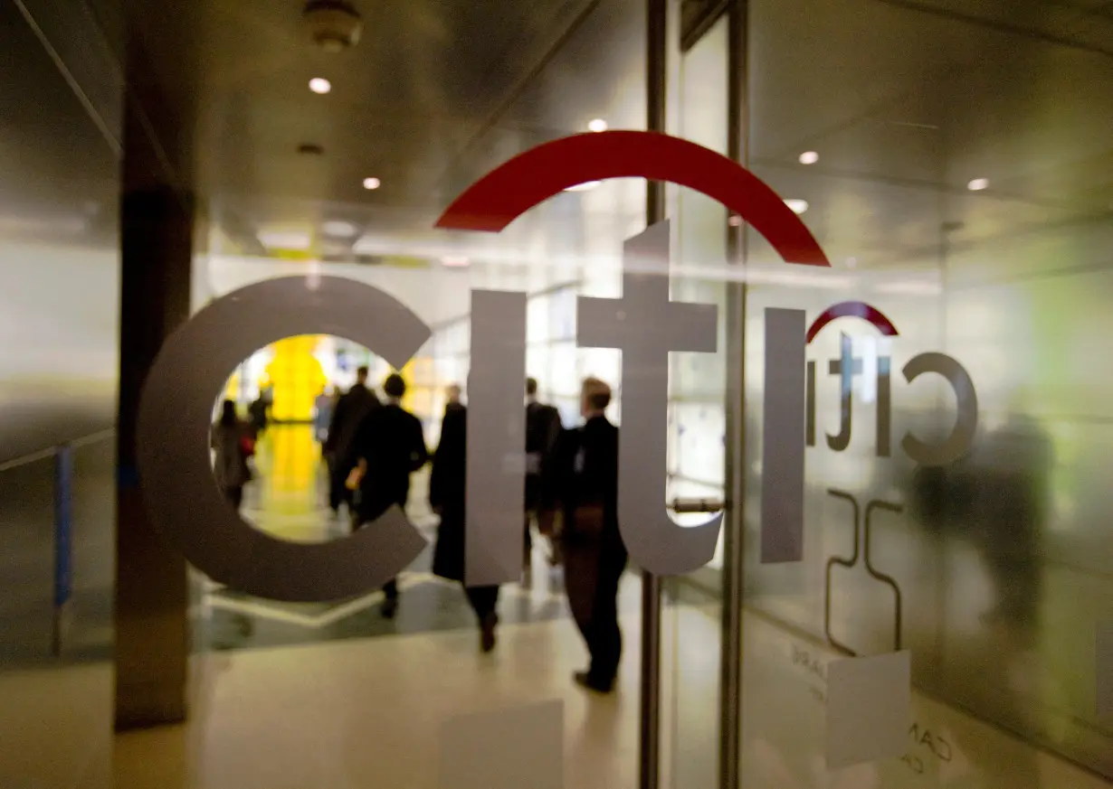 FILE PHOTO: Staff enter the Citigroup building in London