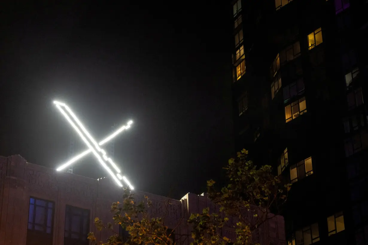 FILE PHOTO: X' logo is seen on the top of the headquarters of the messaging platform X, formerly known as Twitter, in downtown San Francisco, California, U.S., July 30, 2023. REUTERS/Carlos Barria/