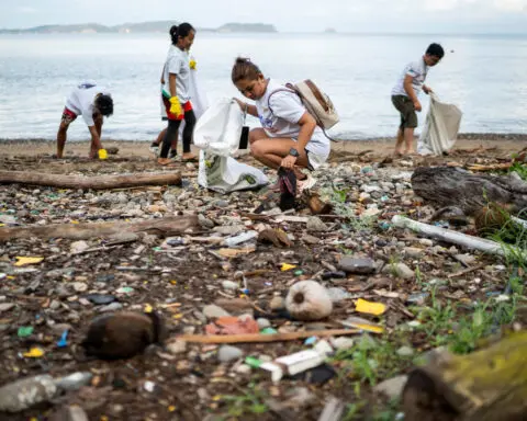 Philippine diving town swaps trash for rice to clean up its beaches