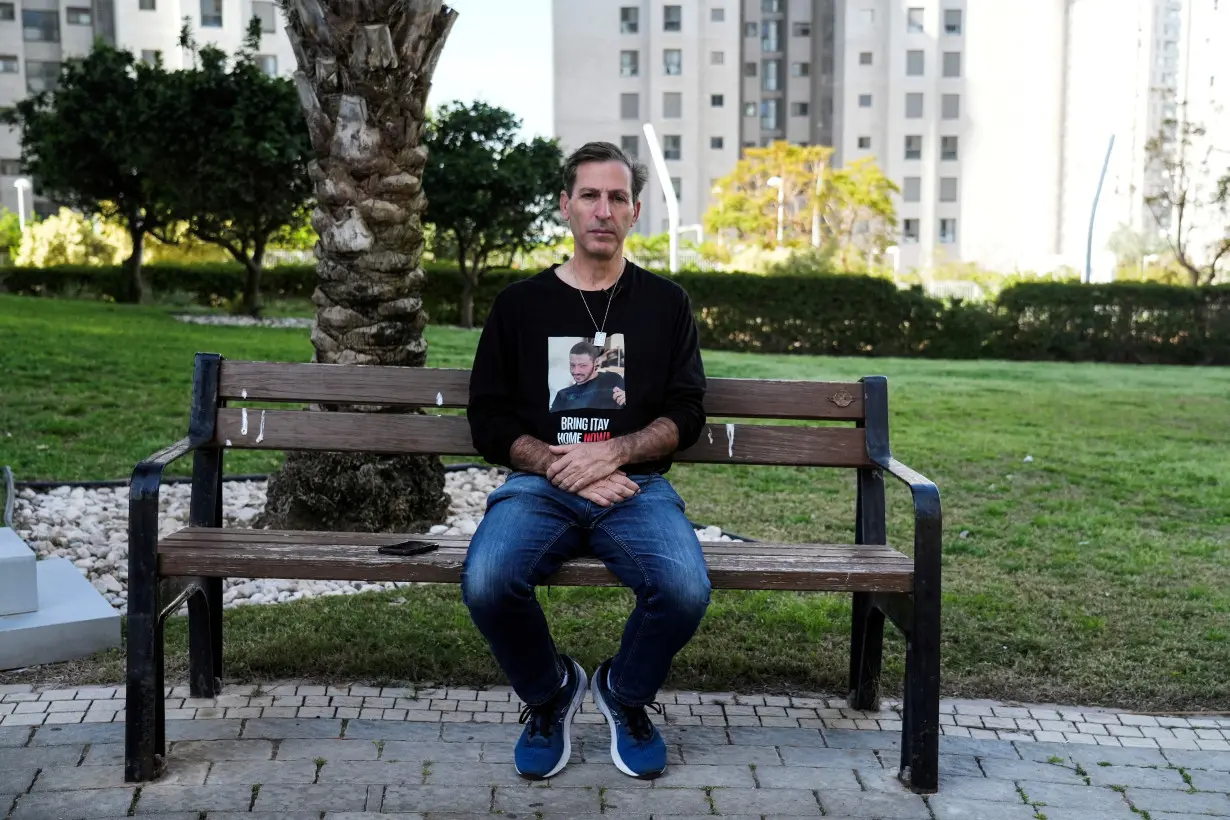 Ruby Chen, father of deceased U.S.-Israeli hostage Itay Chen, whose body is held by the Palestinian Islamist group Hamas in the Gaza Strip, sits on a park bench during an interview with Reuters in Netanya