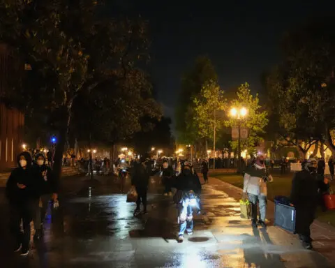 Anti-war protesters leave USC after police arrive, while Northeastern ceremony proceeds calmly