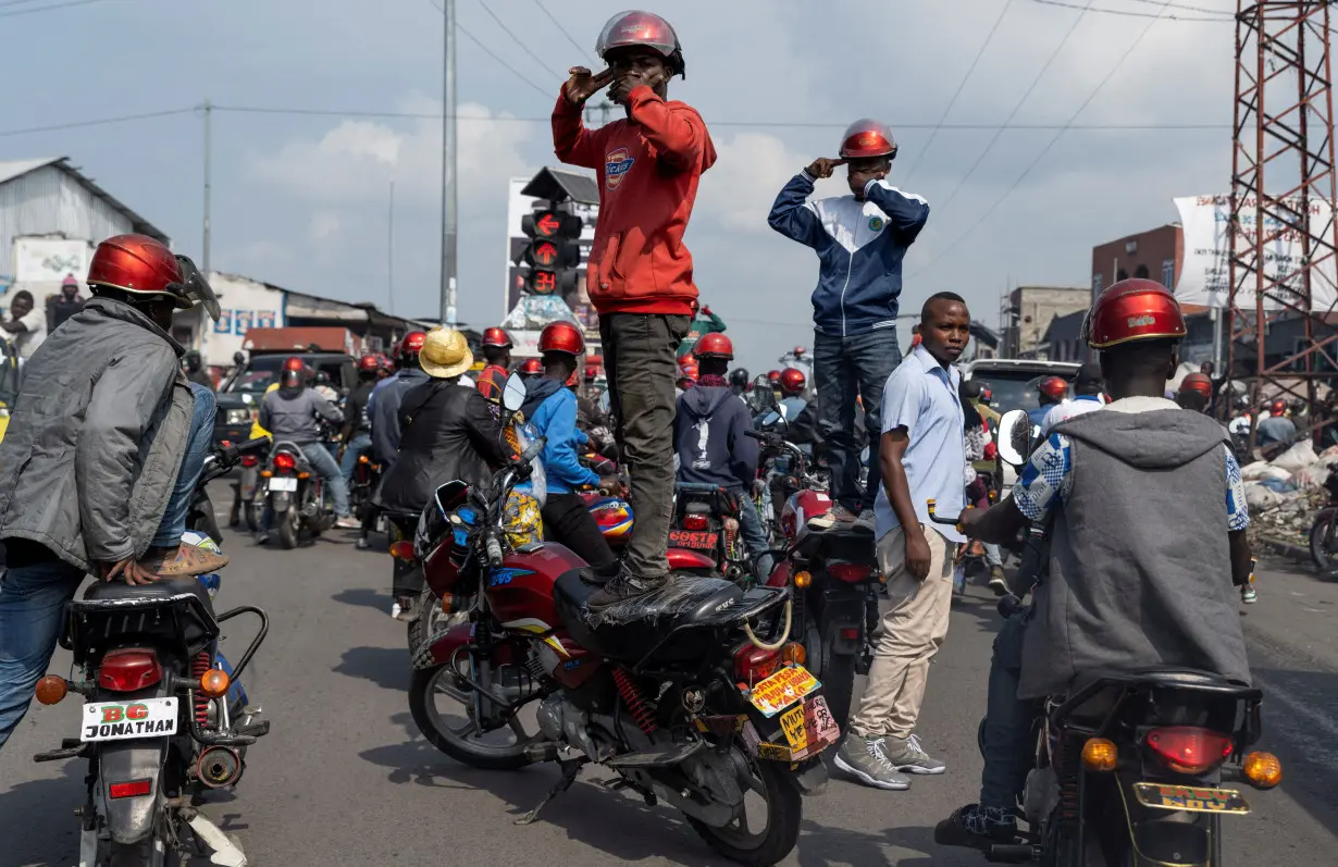 Activists march during a demonstration calling for an end to the fighting between the M23 rebels and the Congolese army and denouncing the international community's silence on the conflicts in Goma