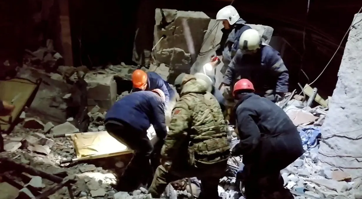 Emergency responders retrieve bodies from the rubble of a devastated building following a Ukrainian attack on the city of Lysychansk