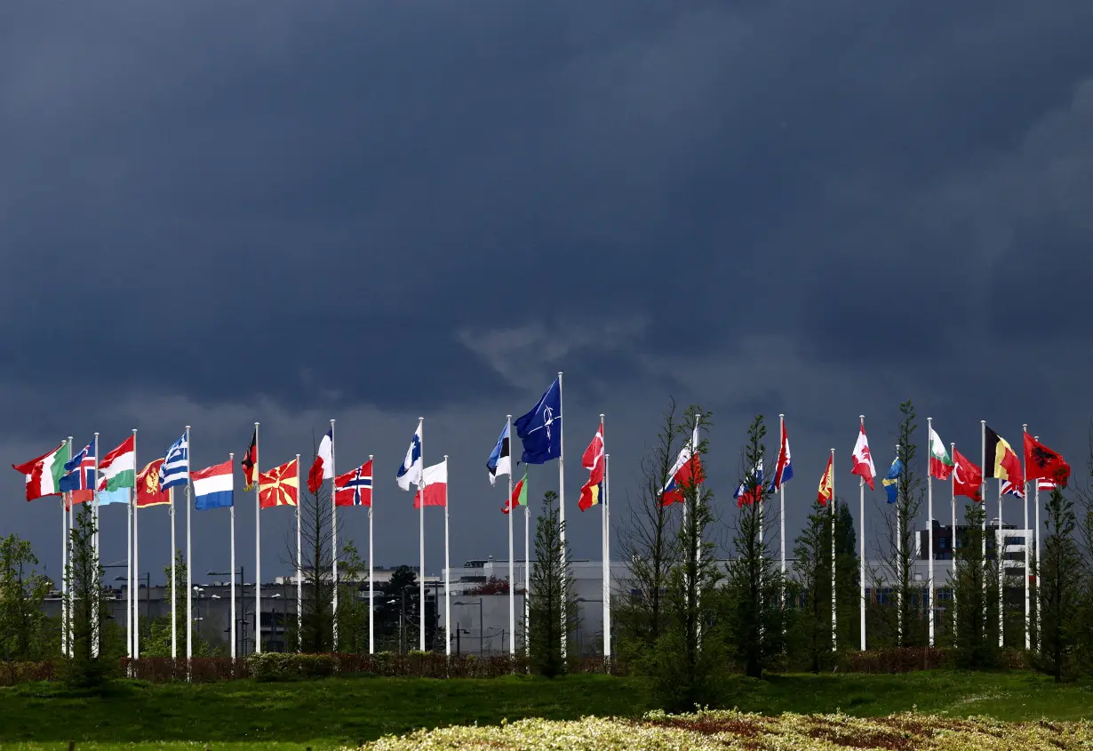 FILE PHOTO: National flags of the Alliance's members flutter at the NATO headquarters in Brussels