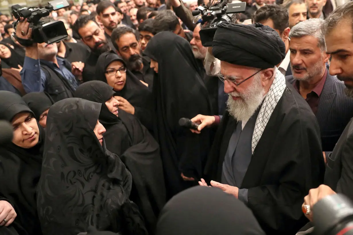 Iran's Supreme Leader, Ayatollah Ali Khamenei, meets with the family of one of the members of the Islamic Revolutionary Guard Corps, in Tehran