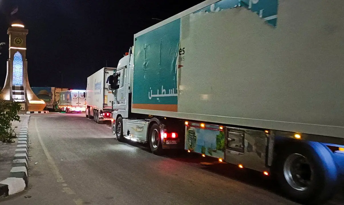 A convoy of trucks carrying humanitarian aid to Palestinians start to move from Al-Arish to Rafah city as they wait for an agreement on the opening on the Rafah border crossing to enter Gaza