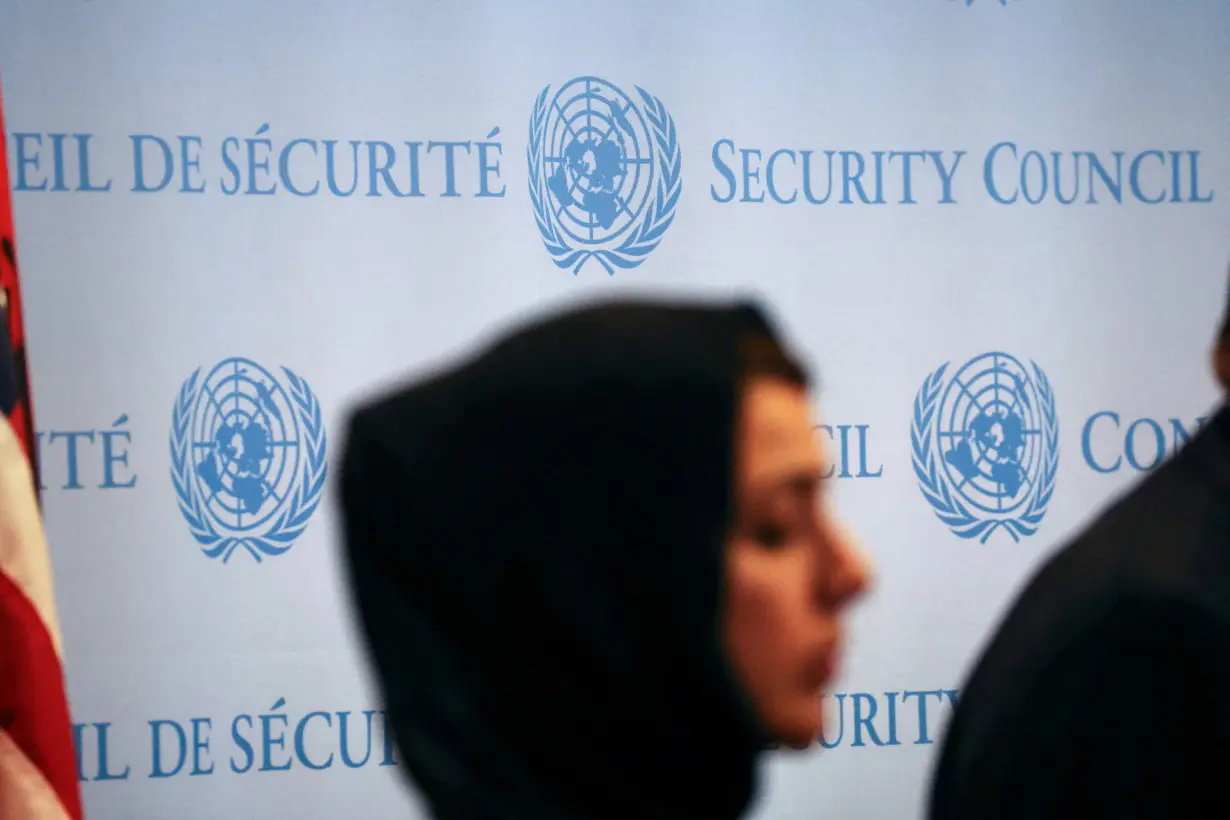 A woman stands during a press conference following the meeting of the Security Council on the conflict between Israel and the Palestinian Islamist group Hamas at U.N. headquarters in New York