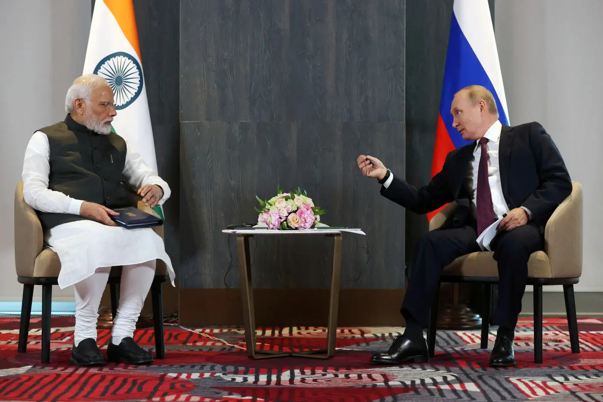 FILE PHOTO: Russian President Putin and Indian Prime Minister Modi meet in Samarkand