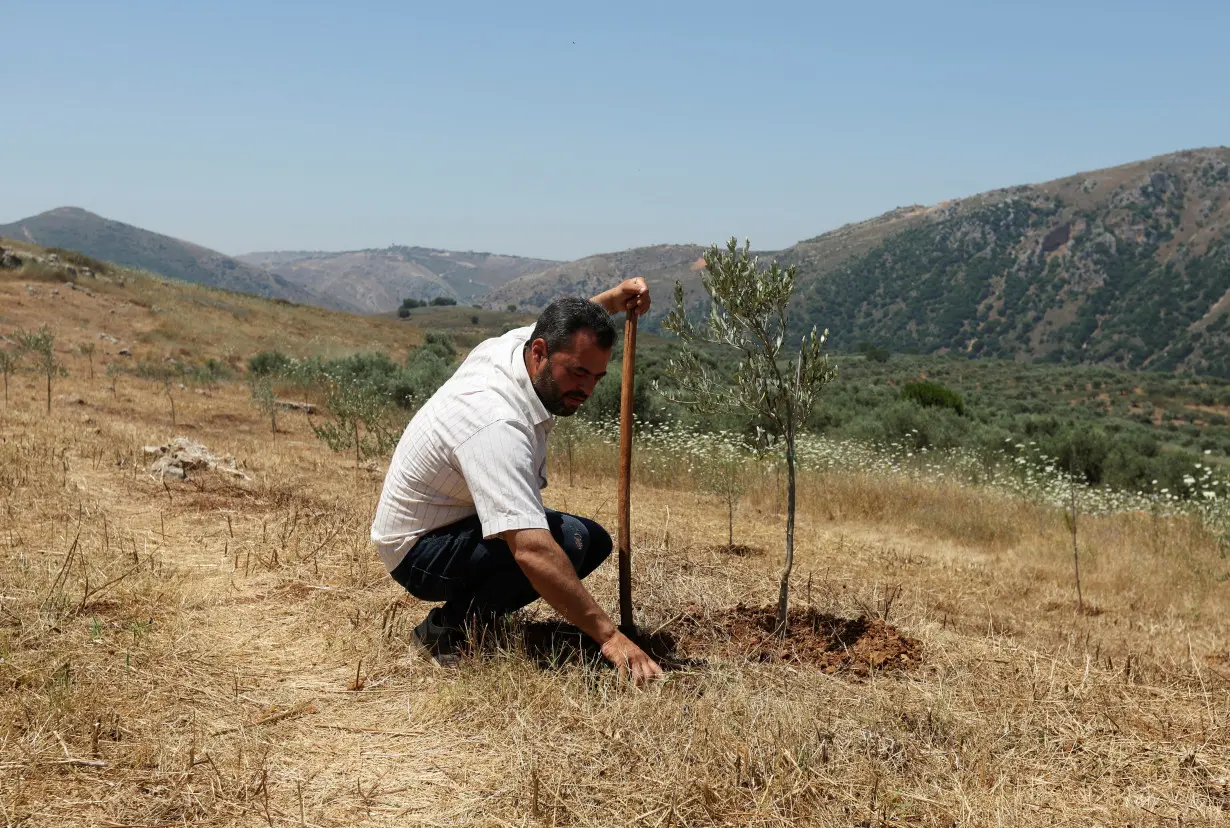 Lebanese farmer Zakaria Farah attends an interview with Reuters in Qlayaa