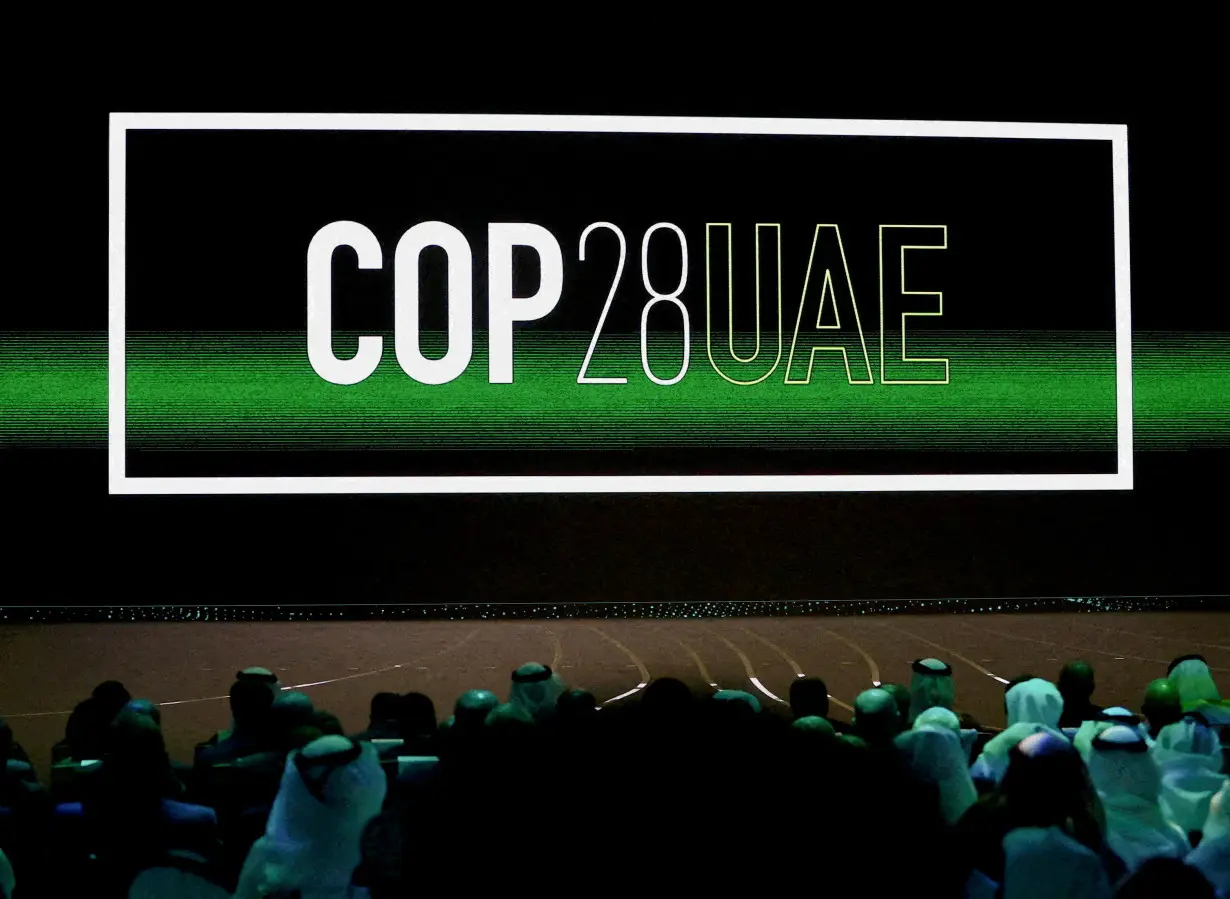 FILE PHOTO: 'Cop28 UAE' logo is displayed on the screen during the opening ceremony of Abu Dhabi Sustainability Week (ADSW) under the theme of 'United on Climate Action Toward COP28', in Abu Dhabi