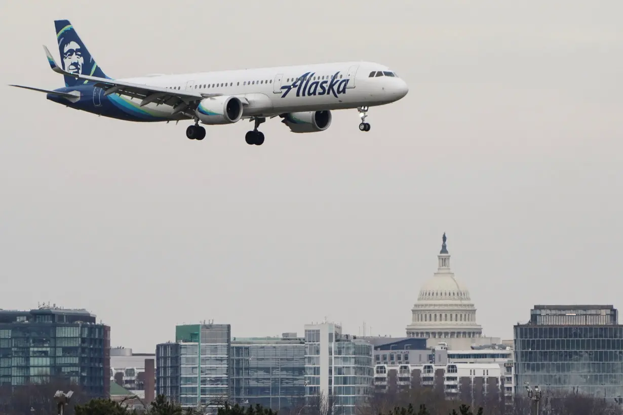 FILE PHOTO: An Alaska Airlines aircraft lands at Reagan National Airport in Arlington, Virginia