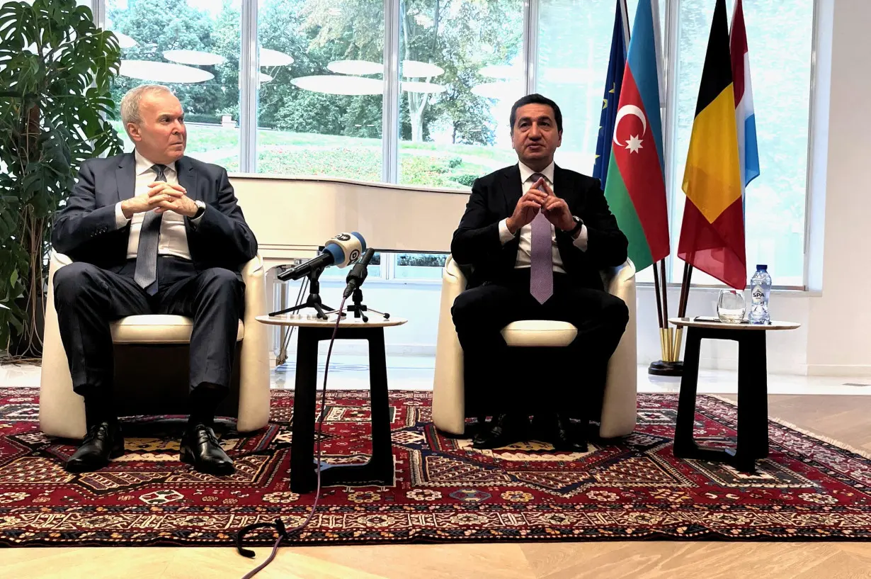 Hikmet Hajiyev, foreign policy adviser to Azerbaijan's President Ilham Aliyev and Vaqif Sadiqov, Ambassador of the Republic of Azerbaijan to Belgium and Luxembourg and Head of Mission to EU talk to reporters in Brussels