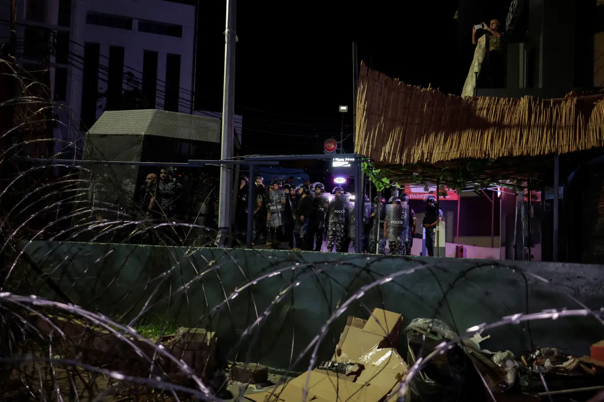 Lebanese security forces stand guard the U.S. embassy as people protest after hundreds of Palestinians were killed in a blast at Al-Ahli hospital in Gaza that Israeli and Palestinian officials blamed on each other, in Beirut,