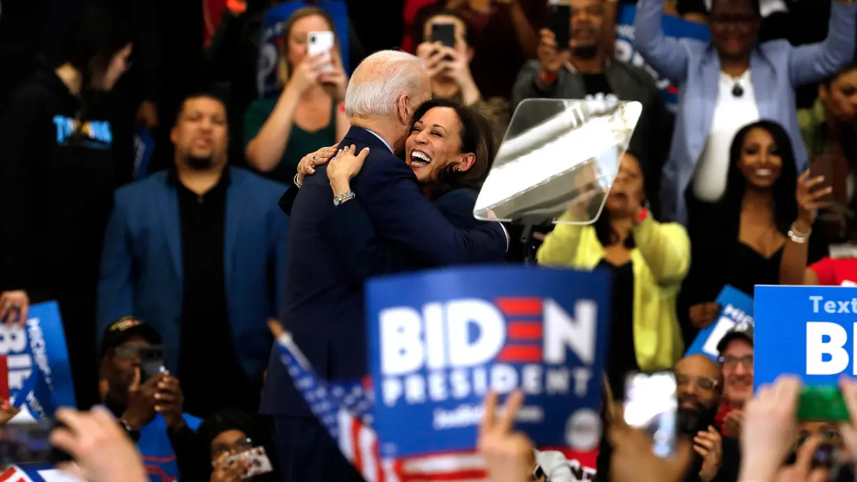 California Senator Kamala Harris (C) hugs Democratic presidential candidate former Vice President Joe Biden after she endorsed him at a campaign rally at Renaissance High School in Detroit, Michigan on March 9, 2020.