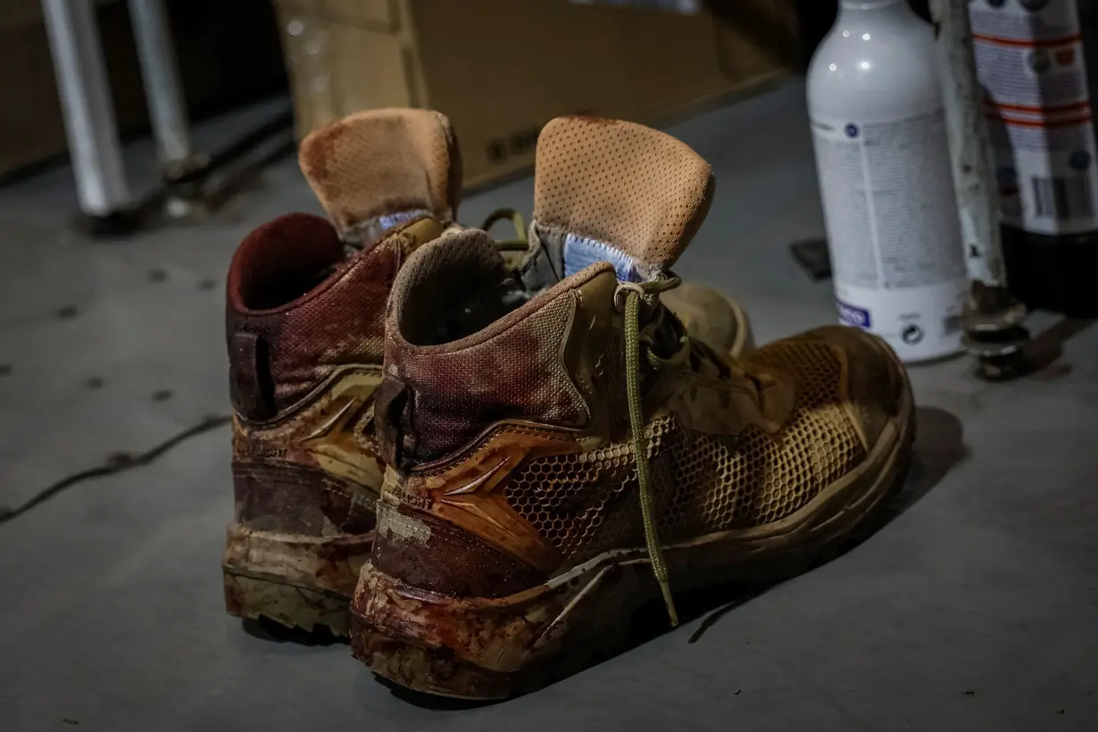 A pair of bloodied army boots of a Ukrainian serviceman is seen inside a medical stabilisation point, near the town of Chasiv Yar, in Donetsk region