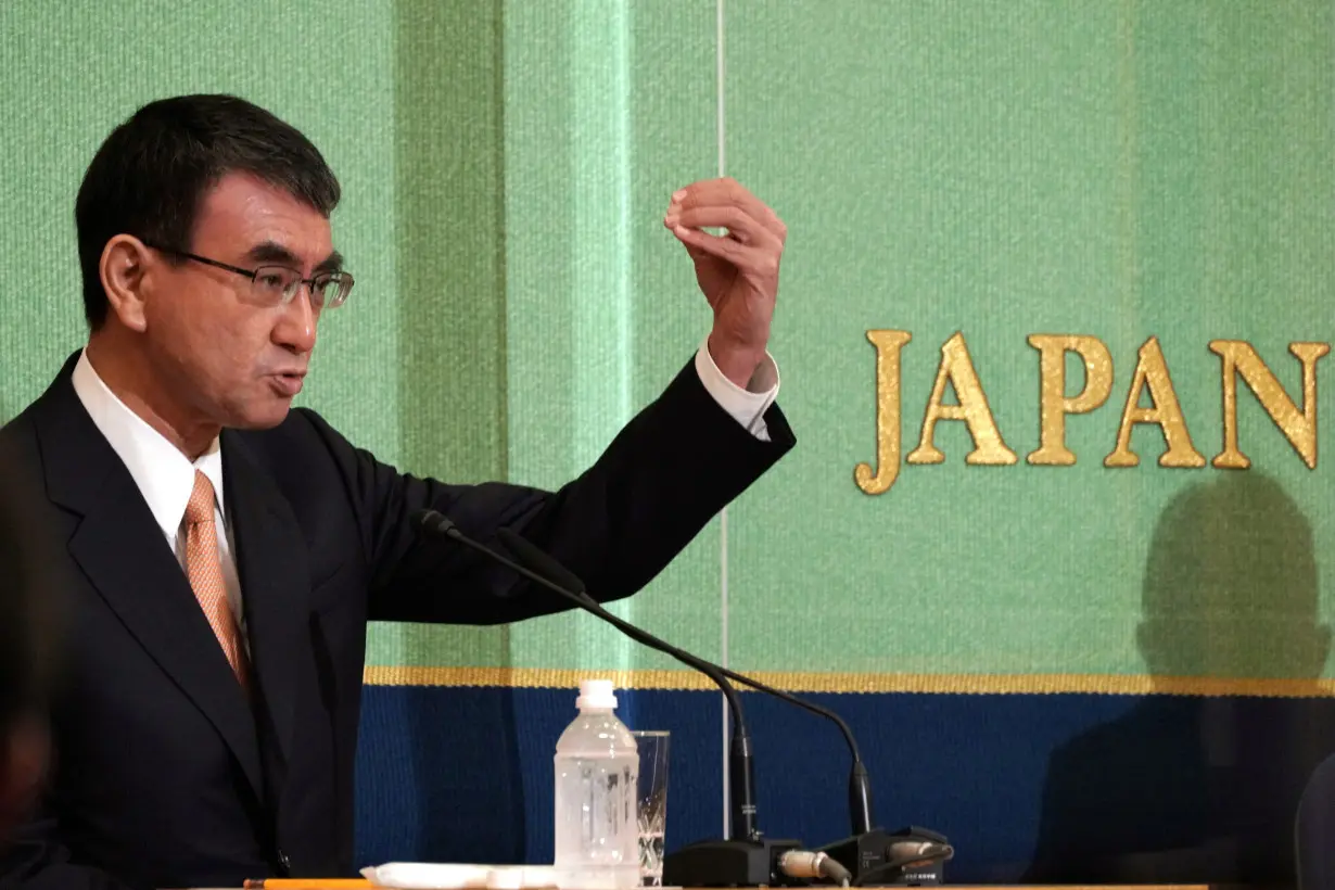 FILE PHOTO: Taro Kono, the cabinet minister in charge of vaccinations, one of the candidates for the presidential election of the ruling Liberal Democratic Party speaks during a debate session held by Japan National Press Club