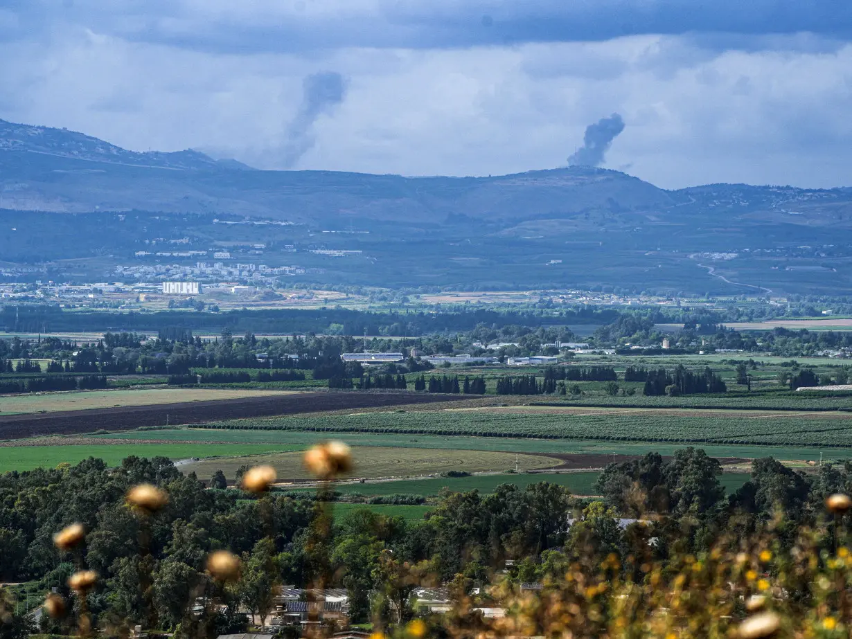 Smoke rises above Lebanon, following an Israeli strike, amid ongoing cross-border hostilities between Hezbollah and Israeli forces, as seen from Israel's border with Lebanon
