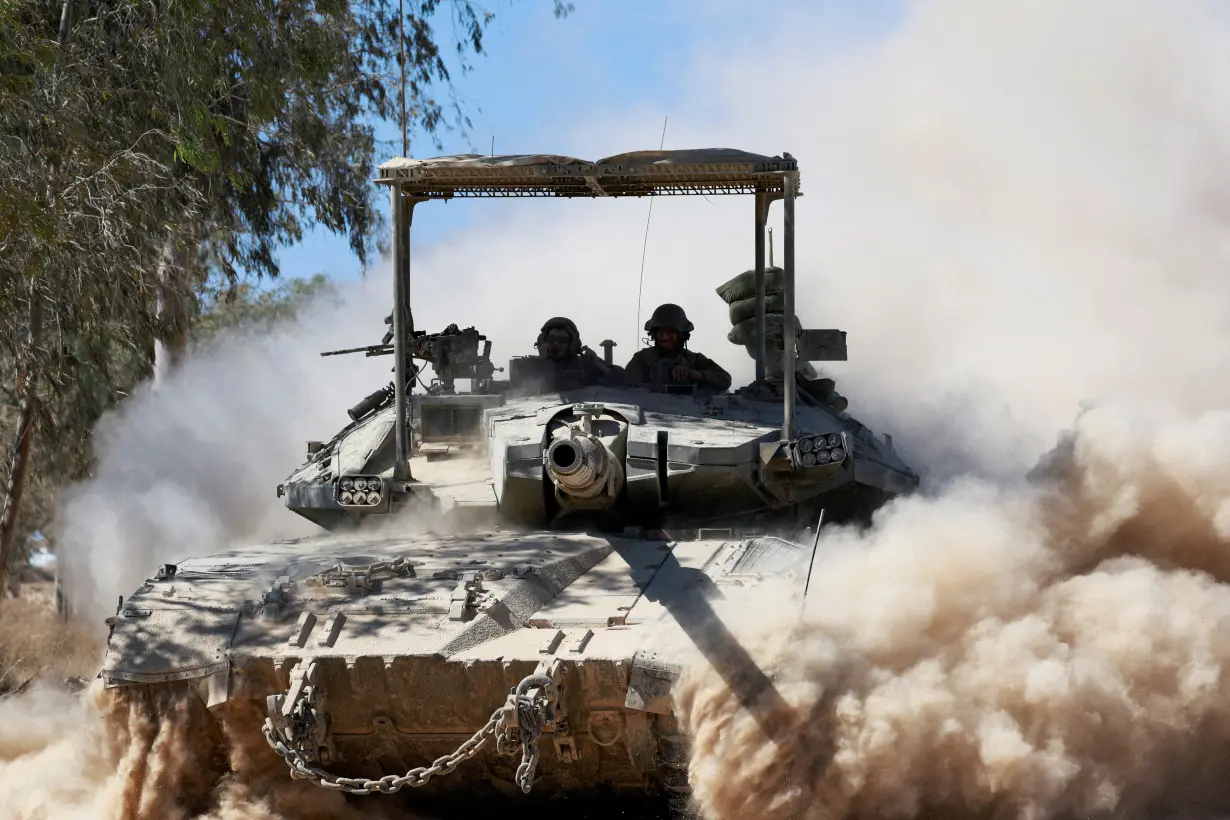 FILE PHOTO: Israeli tank manoeuvres near the Israel-Gaza border