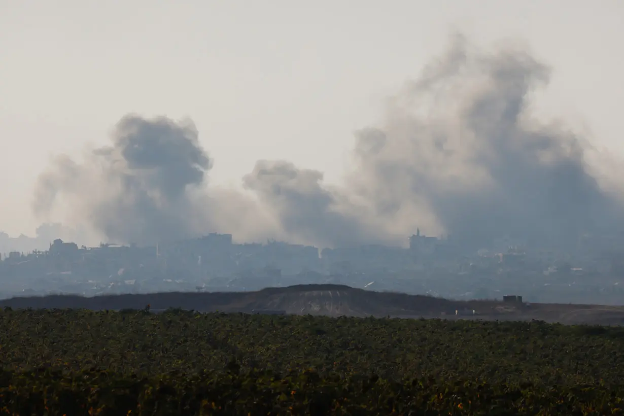 Smoke rises inside Gaza following explosions, amid the Israel-Hamas conflict, near the Israel-Gaza border, in Israel