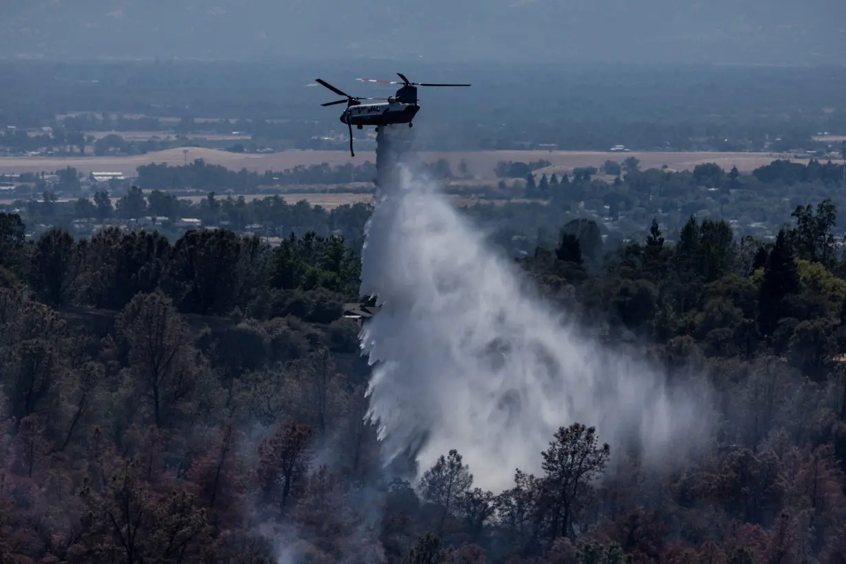 Firefighters battle the Thompson wildfire near Oroville, California