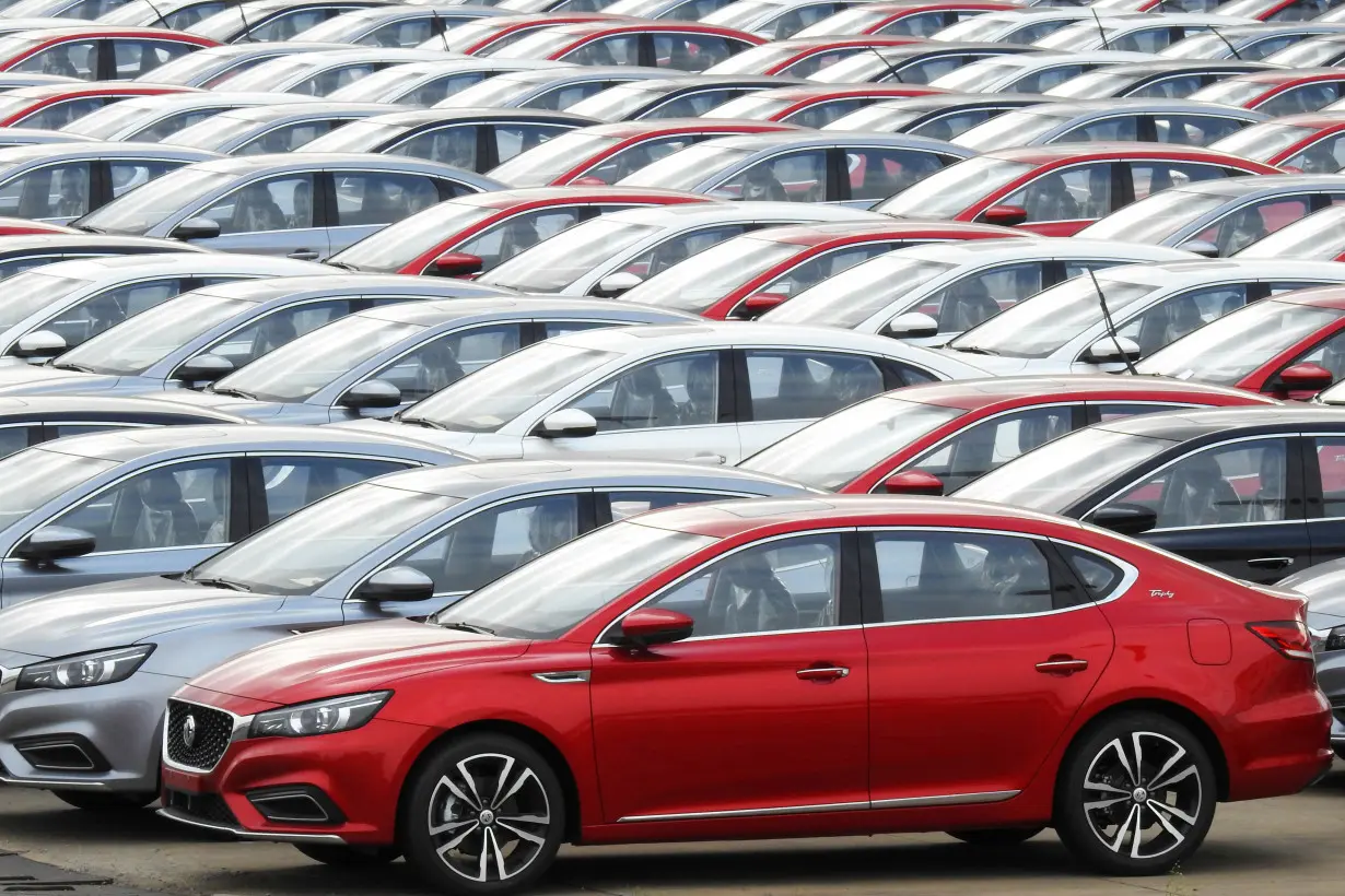 Cars for export wait to be loaded onto cargo vessels at a port in Lianyungang