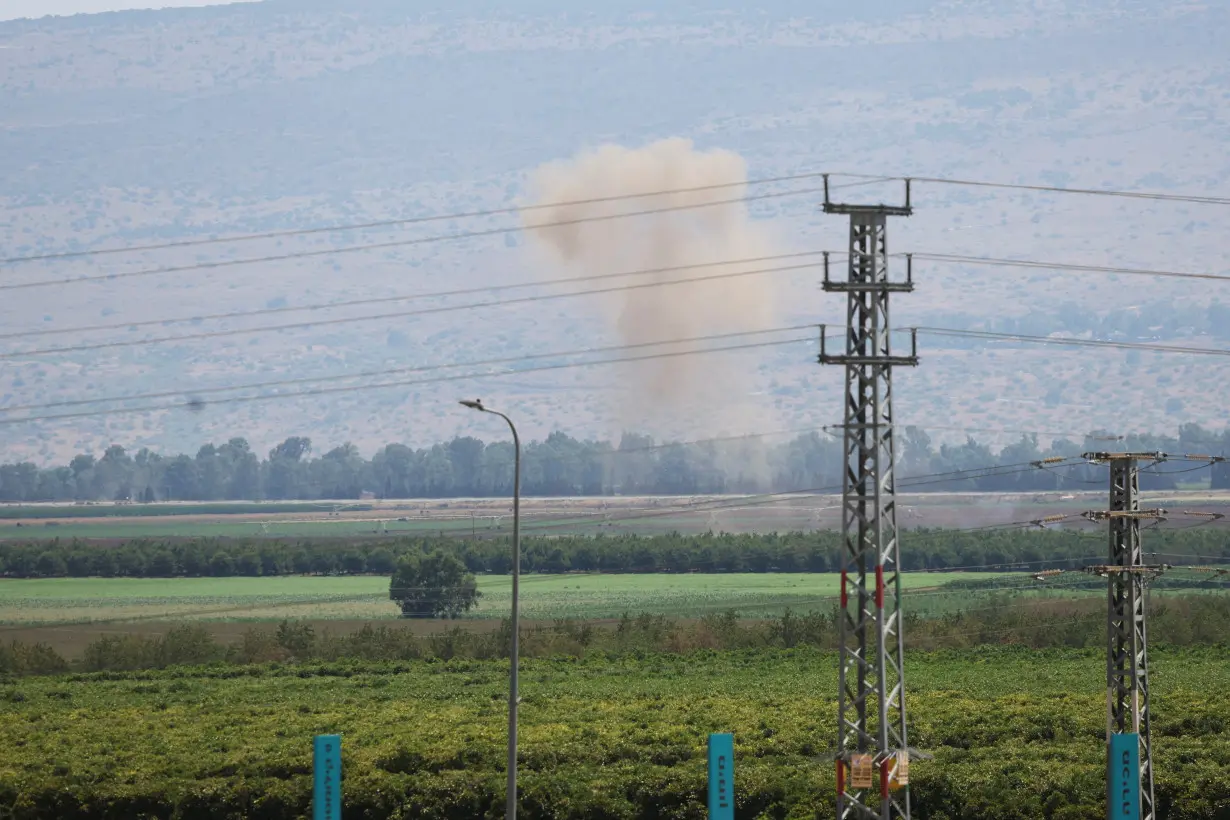 Smoke rises above the Israeli-occupied Golan Heights