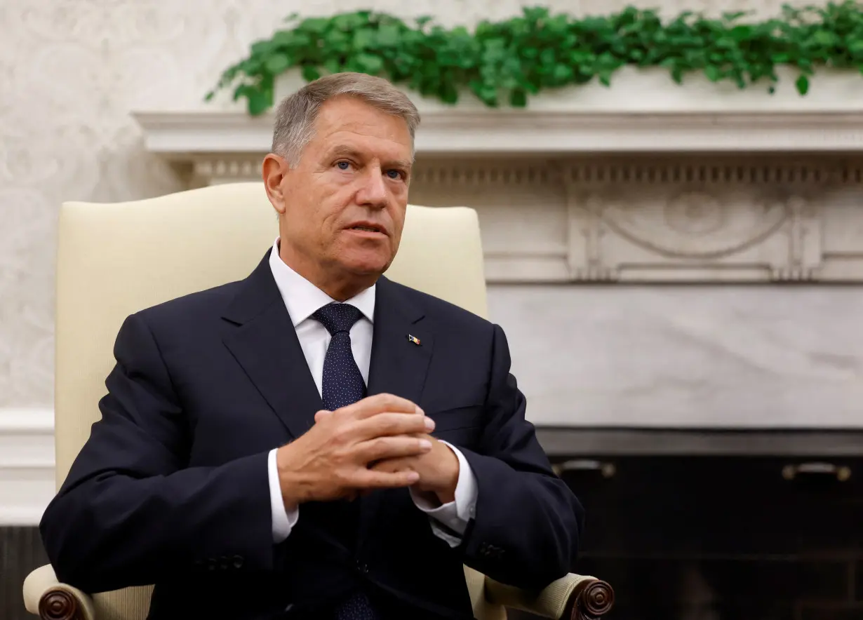 U.S. President Joe Biden meets Romanian President Klaus Iohannis in the Oval Office at the White House in Washington