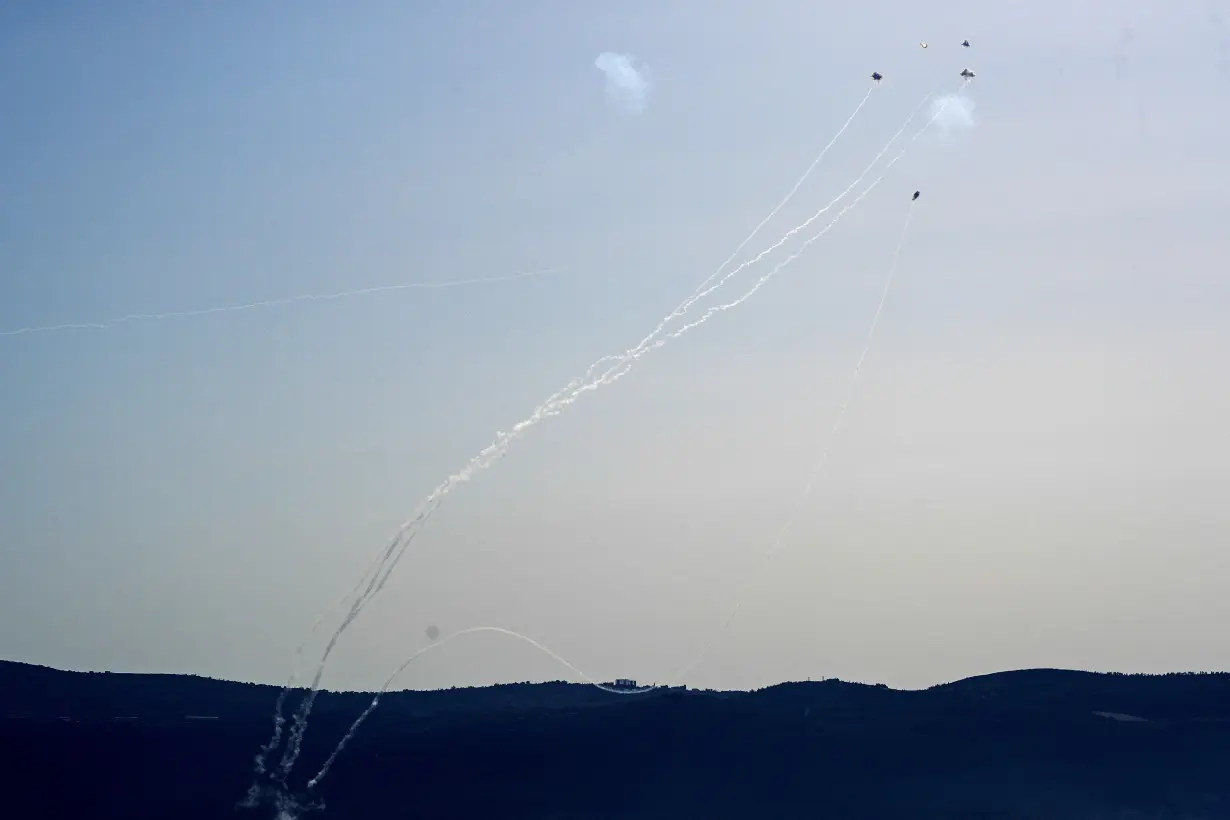 FILE PHOTO: Rockets launched from Lebanon are intercepted in Israel near the border