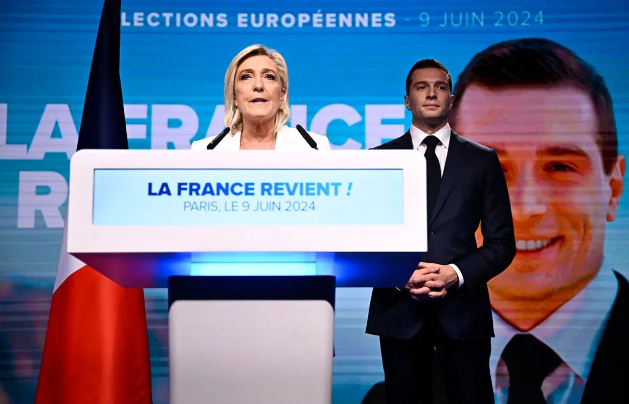 Le Pen and Bardella address a crowd of RN supporters in Paris, after Macron called a snap election, June 9.