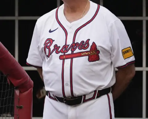 Braves manager Brian Snitker smiles 1 day after being hit below the belt by a foul ball