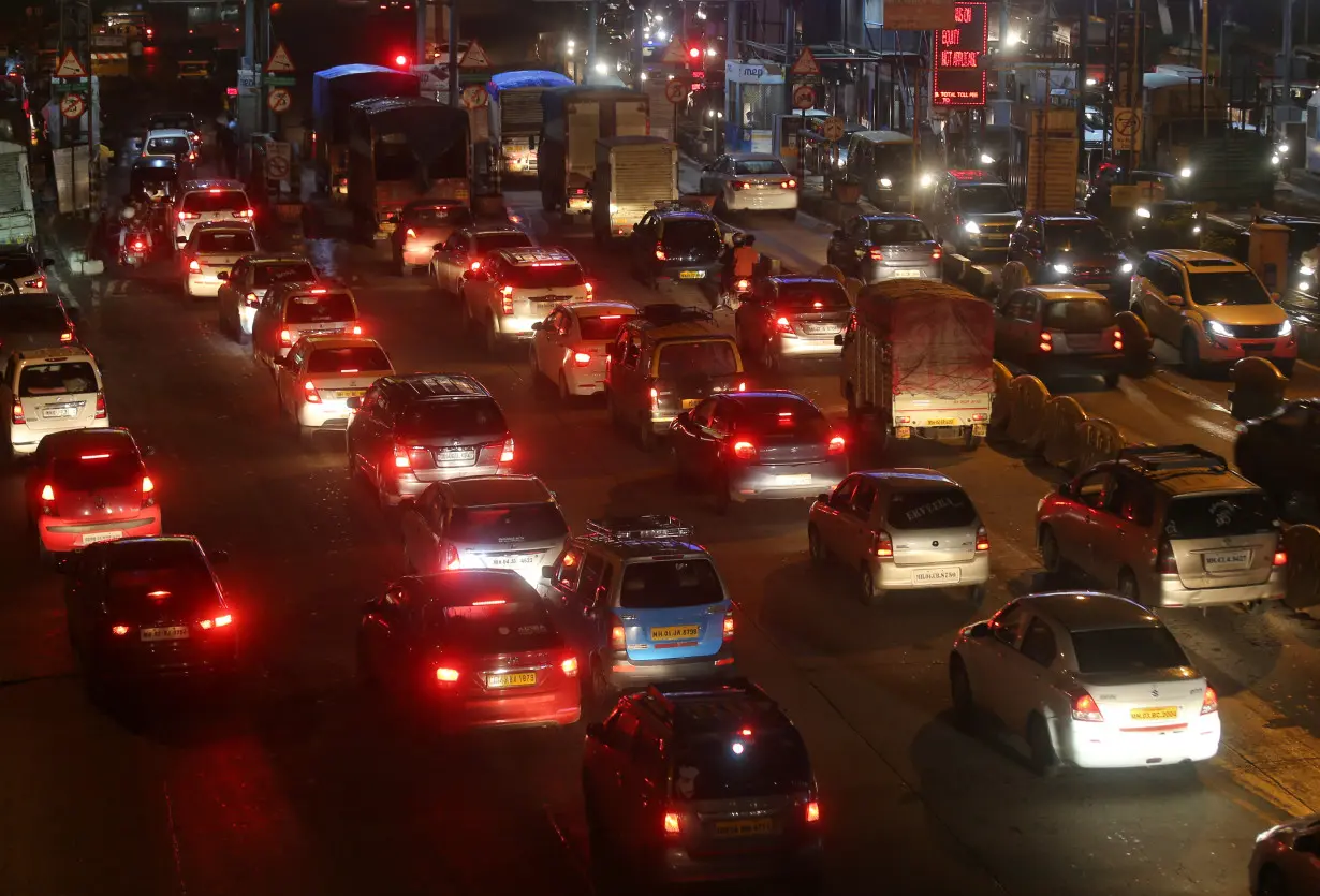 Vehicles are pictured at a toll post in Mumbai