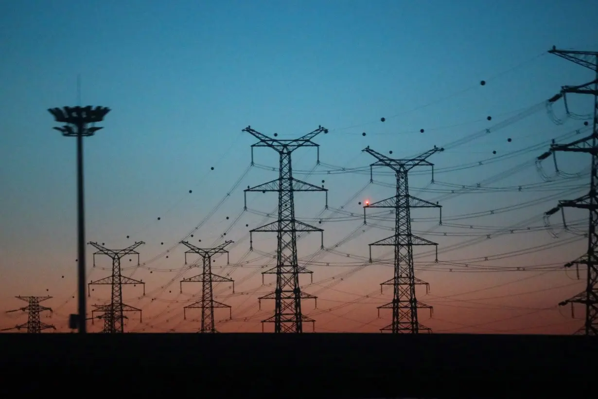 Electrical pylons and power lines are seen in Yanqing district of Beijing