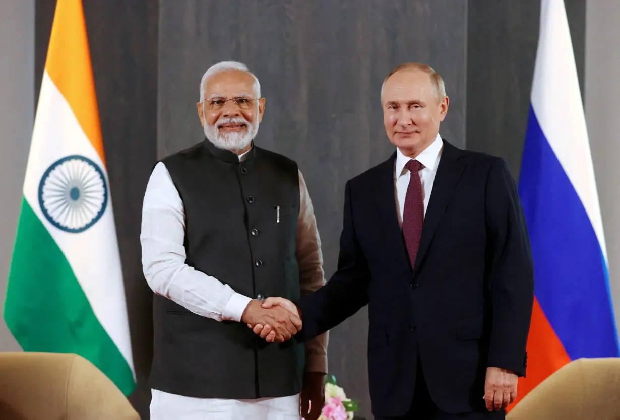 FILE PHOTO: Russian President Putin and Indian Prime Minister Modi meet in Samarkand