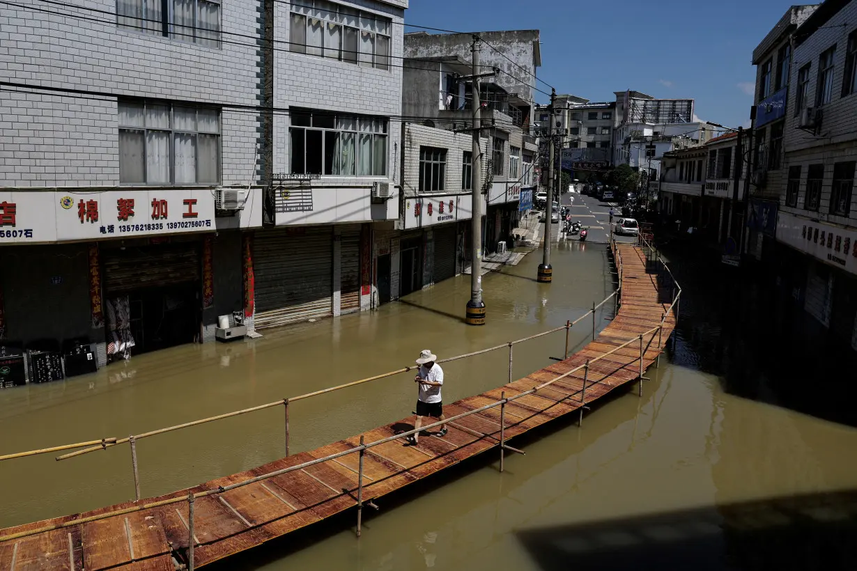 Heavy rainfall and waters from the upstream Yangtze River flooded a town in Hukou county of Jiujiang