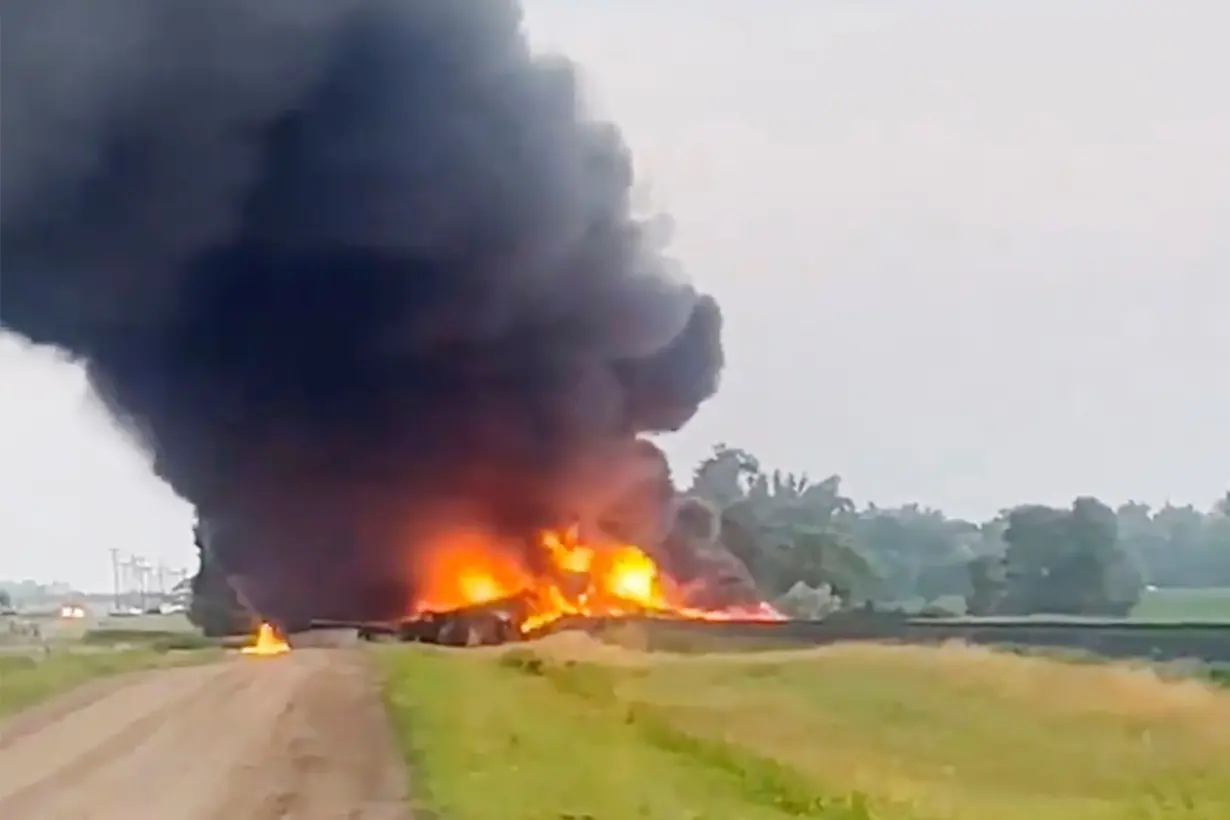 Several train cars carrying hazardous material are on fire after derailing in North Dakota