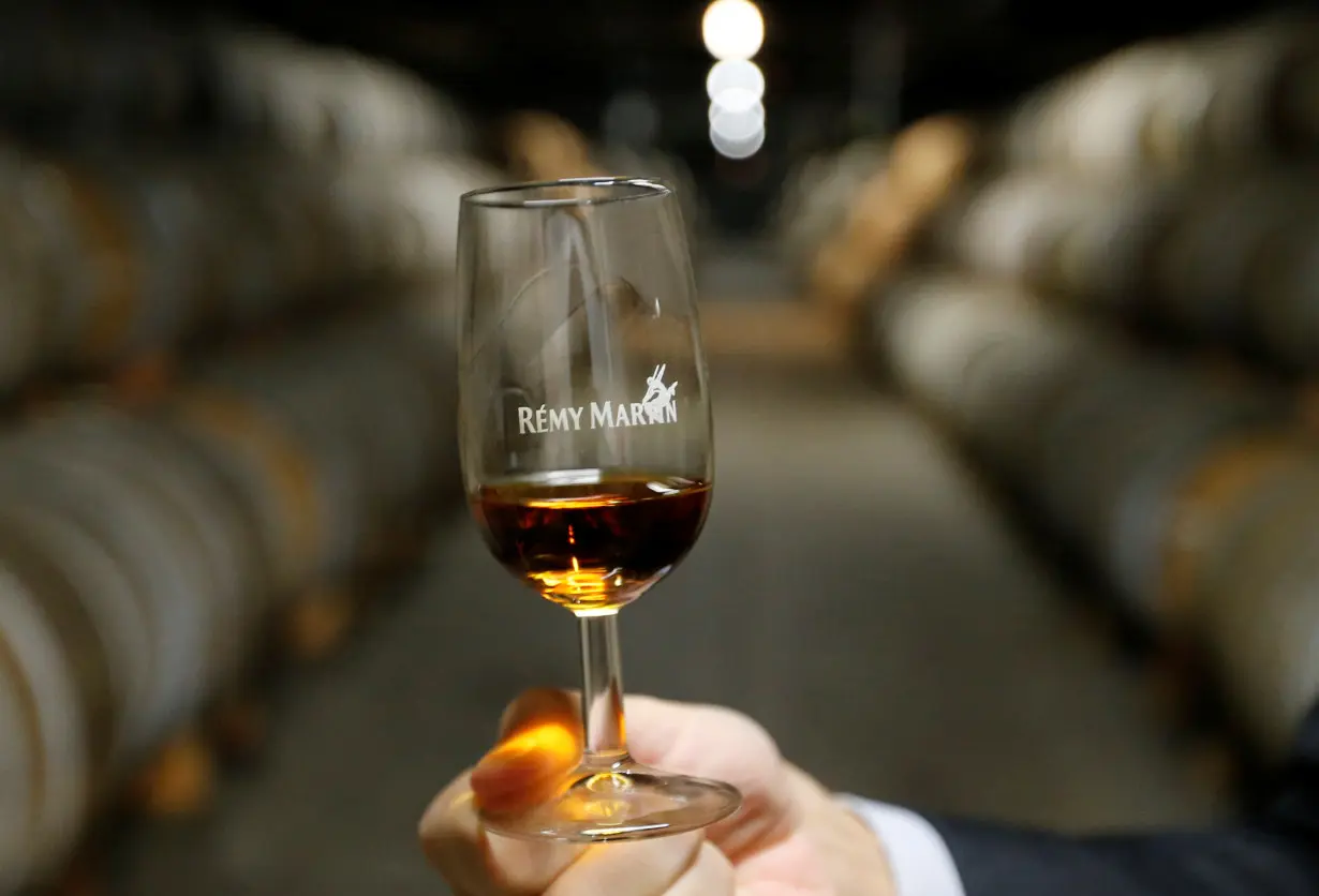 FILE PHOTO: A man tests Cognac in a cellar at the Remy Martin factory in Cognac