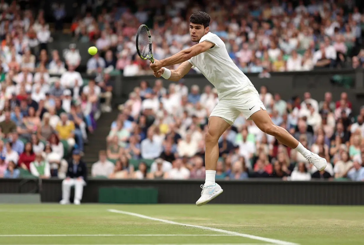 Carlos Alcaraz survives five-set thriller against Frances Tiafoe to advance to Wimbledon fourth round